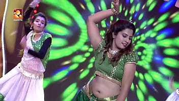 Her Supple Waist Undulates, Revealing A Deep, Inviting Navel As She Dances With Raw, Primal Energy.
