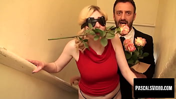 Sultry Blonde Temptress Teases With A Rose Between Her Lips And A Blindfold Shrouding Her Lustful Gaze.